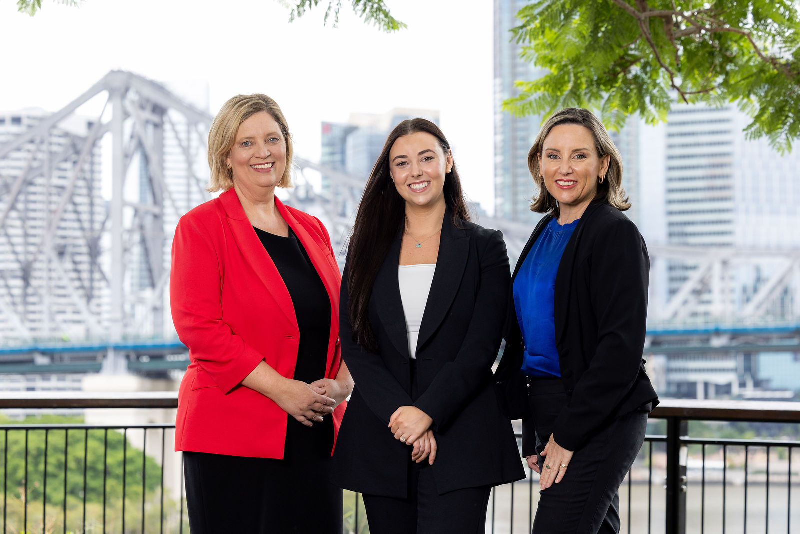 Liz Catton, Ebony Barrett and Angela Tondelstrand from Catton & Tondelstrand Family Lawyers at the firm's Brisbane office overlooking the Brisbane River.